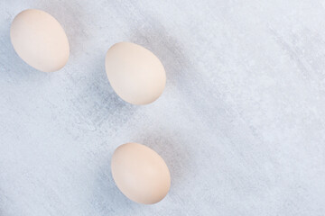 Eggs neatly arranged on marble background