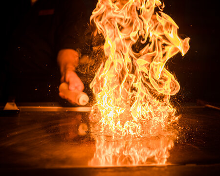 A fire over a hibachi style grill