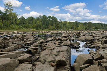 A landscape of scenic rock formations on the beautiful Haw River in Summer in North Carolina