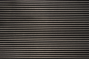 Corrugated cardboard texture in black stripes.