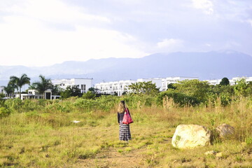 Fototapeta na wymiar Women walking in the nature and sky, Fusagasuga
