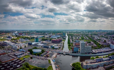 Gordijnen City aerial view of The Hague city center with North Sea on the horizon © john