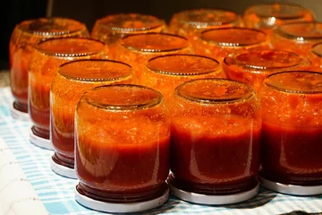 Foto op Canvas Tomato sauce in the jars traditional prep for the winter months © Doruktr/Wirestock Creators