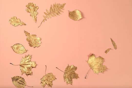 Creative autumn composition flat lay on seasonal background with golden maple leaves, minimal autumn concept, screen banner with place for text. Happy Thanksgiving and greeting card, selective focus
