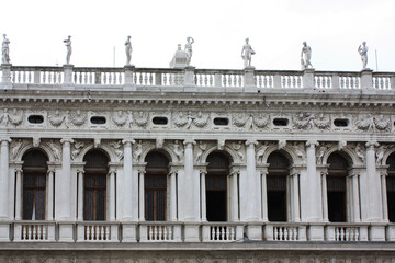 Fototapeta na wymiar Fragment of the building of the Old Procuratie at the Piazza San Marco in Venice, Italy 