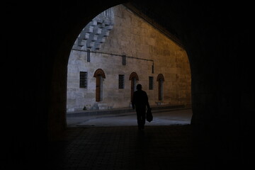 silhouette of a person walking in the night