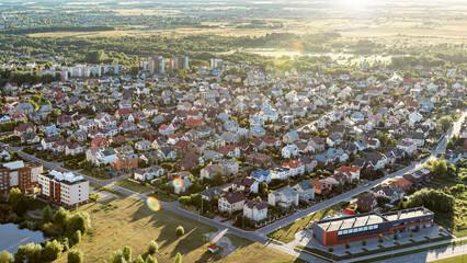 Aerial view of modern roofs of houses of residential area summer houses early sunrise