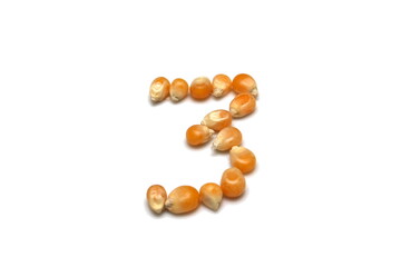 número 3 formado por milhos de pipoca, número três formado por grãos de pipoca, número formado por alimentos