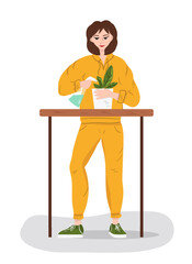 Woman in a tracksuit watering flowers.