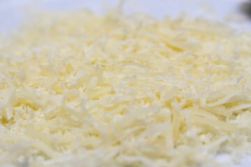 detalhes do queijo parmesão ralado. queijo ralado do tipo parmesão. textura de queijo ralado. 