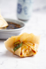 Dumpling with soy, white background