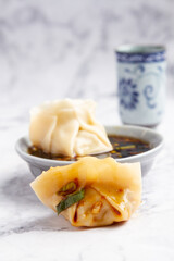 Dumpling with soy, white background