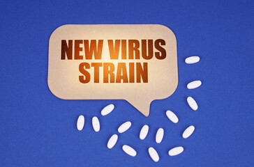 On the blue surface of the tablet and a cardboard plate with the inscription - New virus strain
