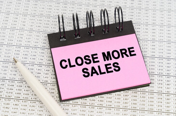 On reporting documents and charts there is a pen and a notepad with the inscription - Close More Sales