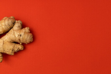 Ginger root on a red background