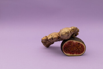 Figs and ginger on a purple background