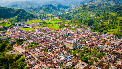 Medellin Mountains Aerial Drone Top Notch Above Jardin in Colonial Humid Valley Neighbourhood, Houses and Clear Skyline