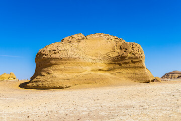 Fototapeta na wymiar Eroded rocks along the interpretive trail at Wadi el-Hitan paleontological site.