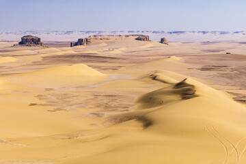 Fototapeta na wymiar Sand dunes in the desert at Wadi el-Hitan paleontological site.