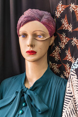 Mannequin with a cracked face.
