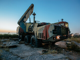 Old rusty broken Russian military vehicle at night