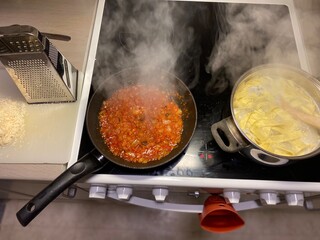 pasta with tomato sauce in pan
