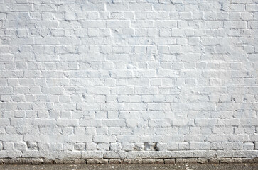 Background texture of the empty blank white old brick wall with rough surface and white paint. Copy space backdrop for your design.
