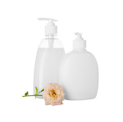 Obraz na płótnie Canvas Dispensers of liquid soap and rose on white background