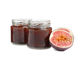 Glass jars of tasty sweet fig jam isolated on white