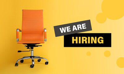Orange office chair and text WE`RE HIRING on yellow background
