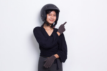Fototapeta premium beautiful asian woman wearing motorcycle helmet pointing with fingers to different directions isolated on white background