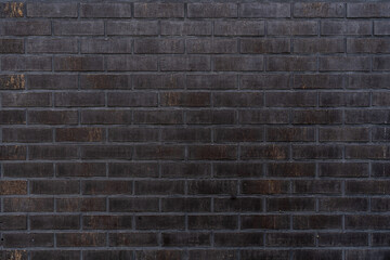 Black brick wall texture background. close up