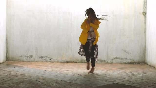 Black woman, hip hop urban dancer and performance with energy, excited talent and freedom outdoors. Young, fashion and creative african female dancing with creative movement, action and ghetto music