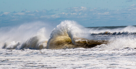 Large rolling waves crashing on the coast of Long Island