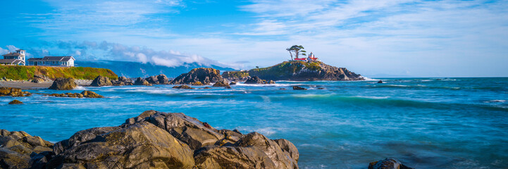 Battery Point Lighthouse and rocky bay at high tide in Crescent City, California. Long exposure...