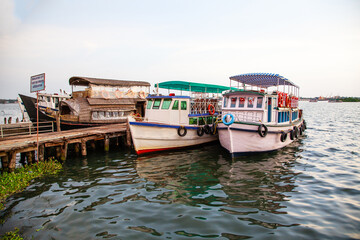 Anchored tourist boats at Ernakulam Jetty of Kerala, India.