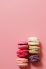 Colorful of sweet French macaroons on pastel color background,copy space.