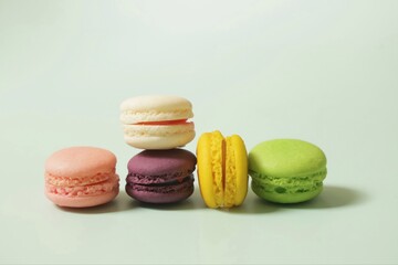 Colorful of sweet French macaroons on pastel color background,copy space.