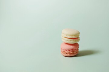 Colorful of sweet French macaroons on pastel color background,copy space.
