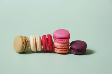 Colorful of sweet French macaroons on pastel color background,copy space.