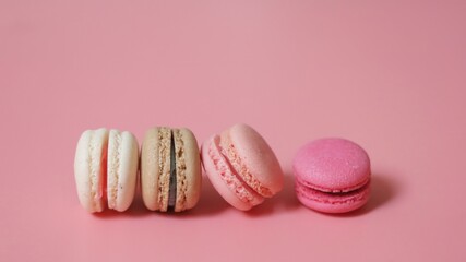 Colorful of sweet French macaroons on pastel color background,copy space.