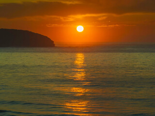 Fototapeta Golden path to the sun over the ocean obraz
