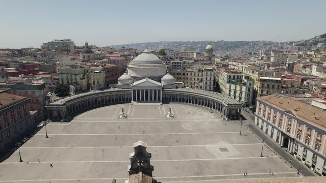 Aerial view Piazza del Plebiscito square in Naples on sunny day, City sprawling in Background. Italy