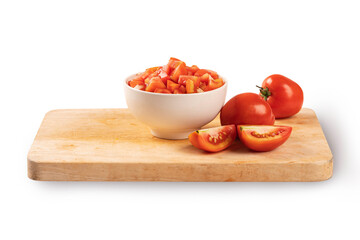 Tomatoes slices in a wooden bowl on cutting board on white background .