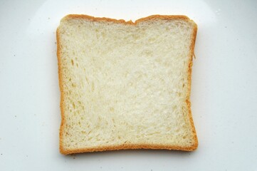 A slice of bread tender texture isolated on white plate background 