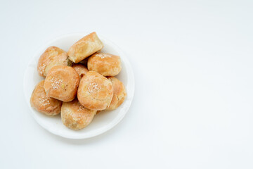 Indonesian local oven baked bread stuffed with green beans, with a crispy layered skin texture
