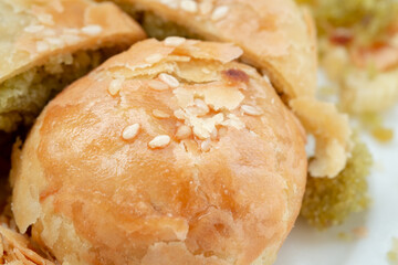 Indonesian local oven baked bread stuffed with green beans, with a crispy layered skin texture