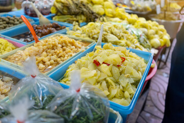Salty vegetable or Chinese cabbage pickled for sale in street food at china town market, Chinese vegetarian festival in Bangkok ,Thailand