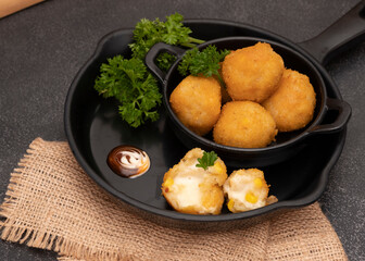 Bitterbalen is a food made from a mixture of wheat flour, liquid milk, cheese, ground beef, steamed potatoes and onions. Selective Focus. Close Up