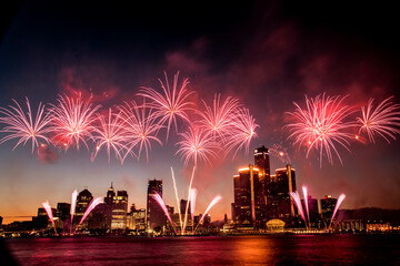 White Fireworks going off during the Detroit Ford Fireworks as seen from the riverwalk in Windsor,...
